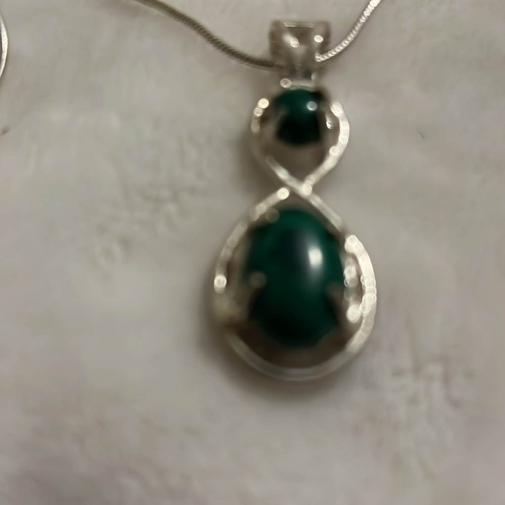 Necklace  Sterling silver necklace with silvertone pendent and dark aqua stones